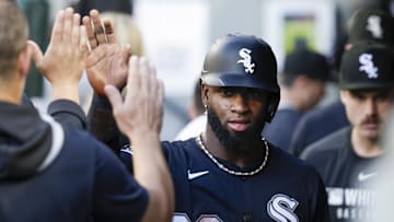 Aug 6, 2025; Seattle, Washington, USA; Chicago White Sox center fielder Luis Robert Jr. (88) high-fives teammates in the dugout after scoring a run against the Seattle Mariners during the second inning at T-Mobile Park. Mandatory Credit: Joe Nicholson-Imagn Images