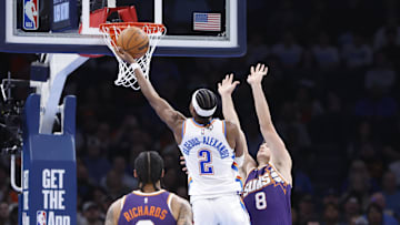 Feb 5, 2025; Oklahoma City, Oklahoma, USA;Oklahoma City Thunder guard Shai Gilgeous-Alexander (2) shoots as Phoenix Suns guard Grayson Allen (8) defends during the second half of a game at Paycom Center. Mandatory Credit: Alonzo Adams-Imagn Images