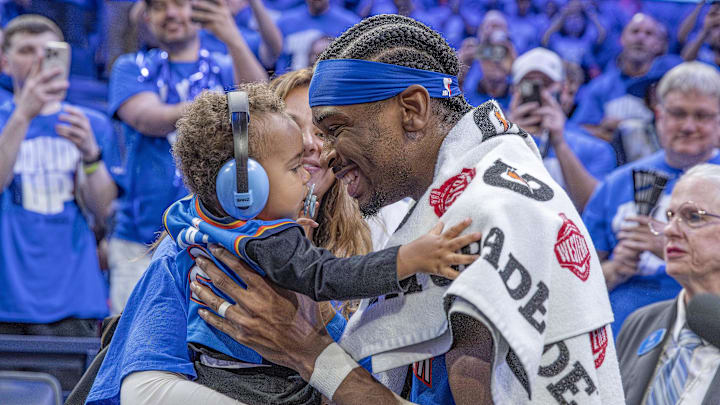 Oklahoma City Thunder guard Shai Gilgeous-Alexander (2) hugs his son and wife. Oklahoma City Thunder guard Shai Gilgeous-Alexander (2) hugs his son and wife.