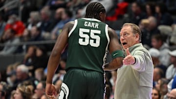Oct 28, 2025; Hartford, CT, USA; Michigan State Spartans head coach Tom Izzo talks with Michigan State Spartans forward Coen Carr (55) during the first half against the Connecticut Huskies at PeoplesBank Arena. Mandatory Credit: Mark Smith-Imagn Images