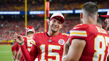 Kansas City Chiefs quarterback Patrick Mahomes talks with tight end Travis Kelce on the sidelines against the Chicago Bears