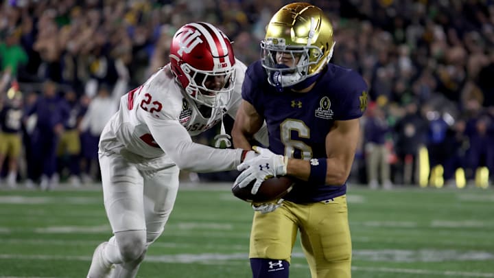 Notre Dame Fighting Irish wide receiver Jordan Faison (6) makes a catch against Indiana Hoosiers defensive back Jamari Sharpe (22) during the second half at Notre Dame Stadium. Notre Dame Fighting Irish wide receiver Jordan Faison (6) makes a catch against Indiana Hoosiers defensive back Jamari Sharpe (22) during the second half at Notre Dame Stadium.