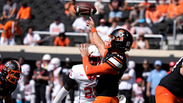Oklahoma State Cowboys quarterback Noah Walters (12) throws a pass during a college football game between the Oklahoma State Cowboys (OSU) and the Houston Cougars at Boone Pickens Stadium in Stillwater, Okla., Saturday, Oct. 11, 2025. Houston won 39-17.