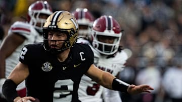 Vanderbilt Commodores quarterback Diego Pavia (2) runs aways from South Carolina Gamecocks’s defense during the first half at FirstBank Stadium in Nashville, Tenn., Saturday, Nov. 9, 2024.