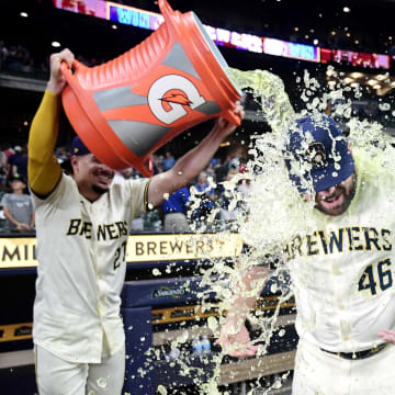 Milwaukee Brewers pitcher Bryse Wilson (46) gets soaked by shortstop Willy Adames (27) after game against the Texas Rangers at American Family Field on June 25.