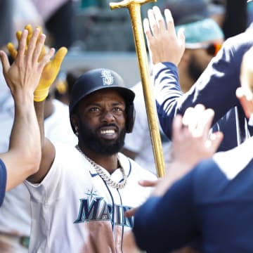 Seattle Mariners left fielder Randy Arozarena (56) celebrates in the dugout after hitting a solo-home run against the Tampa Bay Rays during the eighth inning at T-Mobile Park on Aug 28.