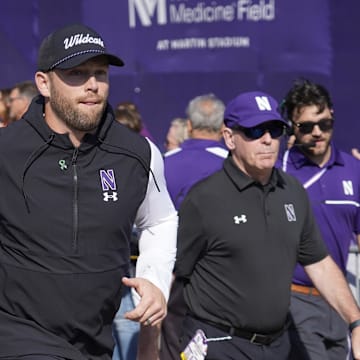 Oct 5, 2024; Evanston, Illinois, USA; Northwestern Wildcats head coach David Braun takes the field against the Indiana Hoosiers at Lanny and Sharon Martin Stadium. Mandatory Credit: David Banks-Imagn Images