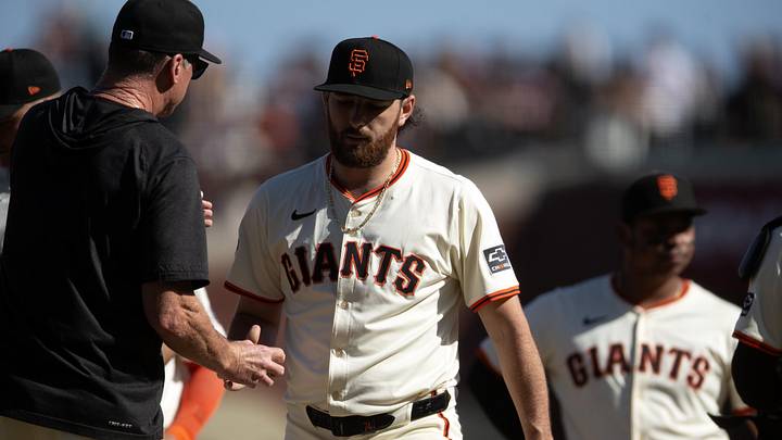 Sep 27, 2025; San Francisco, California, USA; San Francisco Giants pitcher Ryan Walker (74) hands the ball to manager Bob Melvin as he is relieved during the ninth inning against the Colorado Rockies at Oracle Park. Mandatory Credit: D. Ross Cameron-Imagn Images