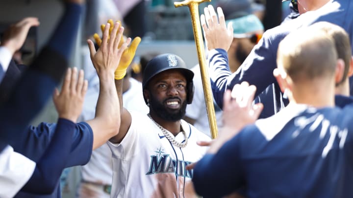 Seattle Mariners left fielder Randy Arozarena (56) celebrates in the dugout after hitting a solo-home run against the Tampa Bay Rays during the eighth inning at T-Mobile Park on Aug 28.