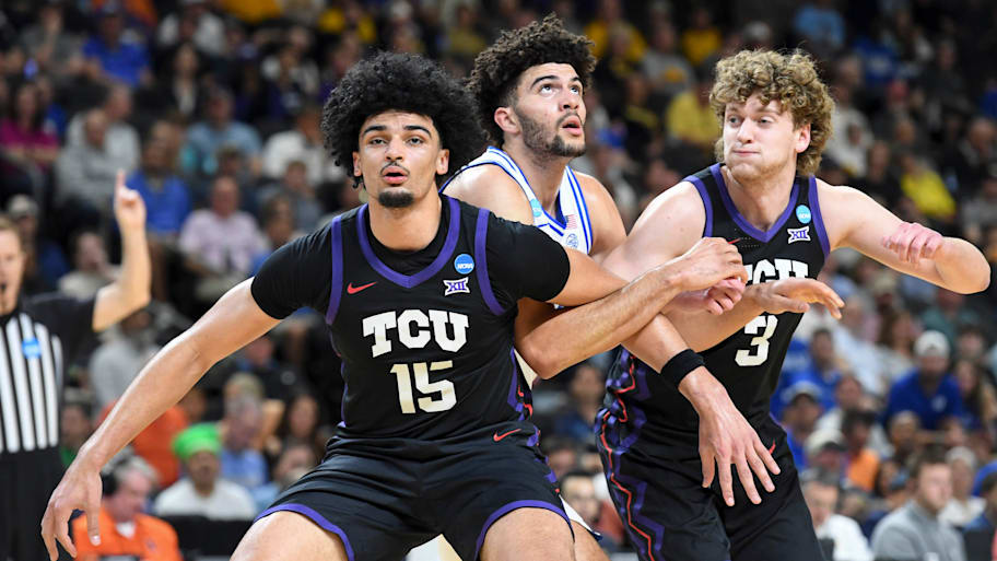 David Punch (left) tussles for a rebound against Duke.