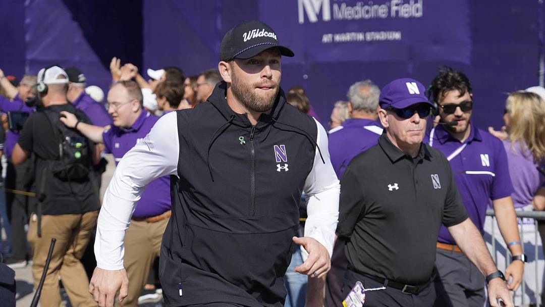 Oct 5, 2024; Evanston, Illinois, USA; Northwestern Wildcats head coach David Braun takes the field against the Indiana Hoosiers at Lanny and Sharon Martin Stadium. Mandatory Credit: David Banks-Imagn Images Oct 5, 2024; Evanston, Illinois, USA; Northwestern Wildcats head coach David Braun takes the field against the Indiana Hoosiers at Lanny and Sharon Martin Stadium. Mandatory Credit: David Banks-Imagn Images