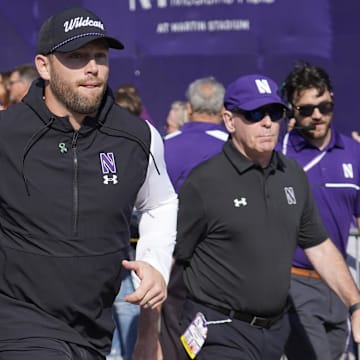 Oct 5, 2024; Evanston, Illinois, USA; Northwestern Wildcats head coach David Braun takes the field against the Indiana Hoosiers at Lanny and Sharon Martin Stadium. Mandatory Credit: David Banks-Imagn Images
