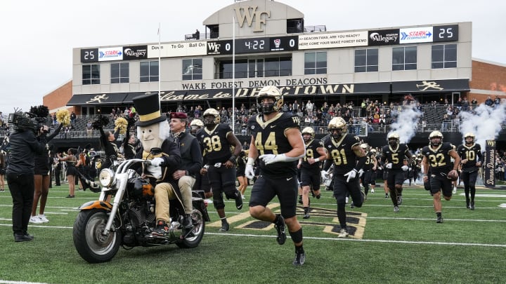 Wake Forest Demon Deacons mascot leads the team onto the field 