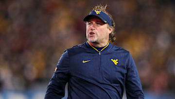 Nov 23, 2018; Morgantown, WV, USA; West Virginia Mountaineers head coach Dana Holgorsen yells along the sidelines during the second quarter against the Oklahoma Sooners at Mountaineer Field at Milan Puskar Stadium. Mandatory Credit: Ben Queen-Imagn Images
