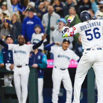 Seattle Mariners left fielder Randy Arozarena (56) celebrates after hitting a solo-home run against the Athletics during the eighth inning at T-Mobile Park.  Images
