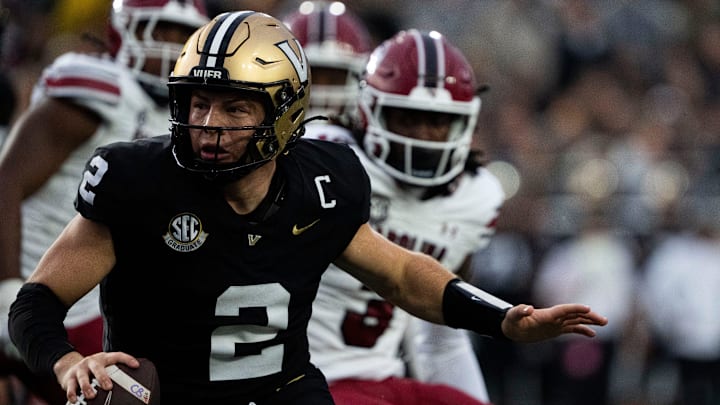 Vanderbilt Commodores quarterback Diego Pavia (2) runs aways from South Carolina Gamecocks’s defense during the first half at FirstBank Stadium in Nashville, Tenn., Saturday, Nov. 9, 2024.