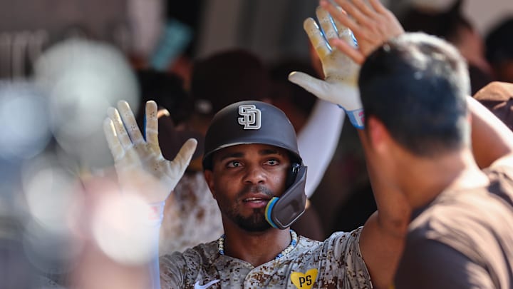 Sep 8, 2024; San Diego, California, USA; San Diego Padres second baseman Xander Bogaerts (2) celebrates with teammates after hitting a two run home run during the eighth inning against the San Francisco Giants at Petco Park. Mandatory Credit: Chadd Cady-Imagn Images