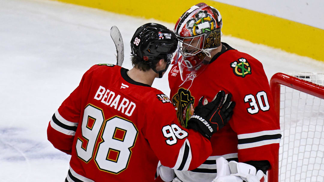 Oct 13, 2025; Chicago, Illinois, USA;  Chicago Blackhawks center Connor Bedard (98) congratulates Chicago Blackhawks goaltender Spencer Knight (30) after the third period against the Utah Mammoth at United Center. Mandatory Credit: Matt Marton-Imagn Images