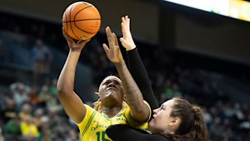 Oregon center Phillipina Kyei goes up for a shot under cover from Purdue forward Lana McCarthy as the Oregon Ducks host the Purdue Boilermakers on Wednesday, Jan. 15, 2025, at Matthew Knight Arena in Eugene, Ore.