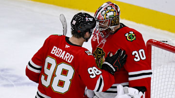 Oct 13, 2025; Chicago, Illinois, USA;  Chicago Blackhawks center Connor Bedard (98) congratulates Chicago Blackhawks goaltender Spencer Knight (30) after the third period against the Utah Mammoth at United Center. Mandatory Credit: Matt Marton-Imagn Images