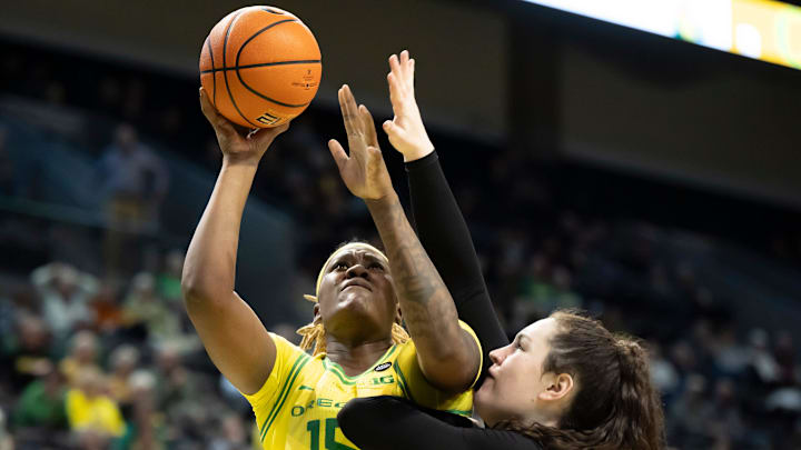 Oregon center Phillipina Kyei goes up for a shot under cover from Purdue forward Lana McCarthy as the Oregon Ducks host the Purdue Boilermakers on Wednesday, Jan. 15, 2025, at Matthew Knight Arena in Eugene, Ore.