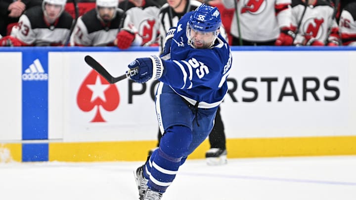 Apr 11, 2024; Toronto, Ontario, CAN; Toronto Maple Leafs defenseman Mark Giordano (55) shoots the puck against the New Jersey Devils in the first period at Scotiabank Arena. Mandatory Credit: Dan Hamilton-Imagn Images