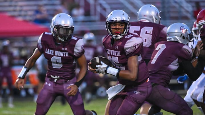 Lake Worth quarterback Rasheem Bryant (16) handles the ball during the football game between Forest Hill and host Lake Worth on Friday, September 23, 2022, in Lake Worth Beach, FL. Final score, Forest Hill, 26, Lake Worth, 21.
