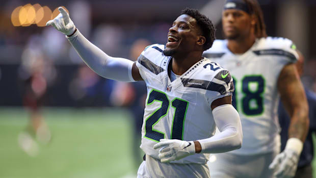 Seattle Seahawks cornerback Devon Witherspoon runs off the field before a game against the Atlanta Falcons.