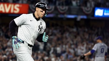 Oct 30, 2024; New York, New York, USA; New York Yankees outfielder Aaron Judge (99) reacts after hitting a two-run home run during the first inning against the Los Angeles Dodgers in game five of the 2024 MLB World Series at Yankee Stadium. Mandatory Credit: Vincent Carchietta-Imagn Images