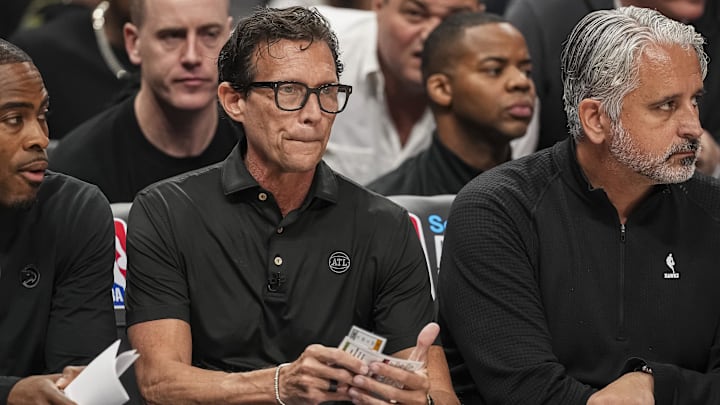 Atlanta Hawks head coach Quin Snyder sits on the bench against the Miami Heat.