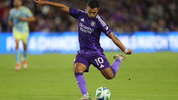 Feb 22, 2025; Orlando, Florida, USA; Orlando City midfielder Martin Ojeda (10) kicks the ball against the Philadelphia Union in the first half at Inter&Co Stadium. Mandatory Credit: Morgan Tencza-Imagn Images