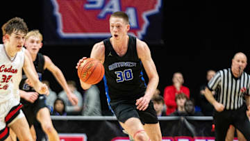 Waukee Northwest's Landon Davis (30) drives down the court on Wednesday, March 12, 2025, at Wells Fargo Arena.