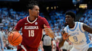 Dec 4, 2024; Chapel Hill, North Carolina, USA; Alabama Crimson Tide forward Jarin Stevenson (15) with the ball as North Carolina Tar Heels guard Drake Powell (9) defends in the first half at Dean E. Smith Center. Mandatory Credit: Bob Donnan-Imagn Images