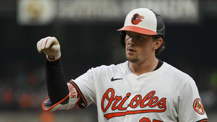 Jul 30, 2024; Baltimore, Maryland, USA;  Baltimore Orioles catcher Adley Rutschman (35) reacts after hitting a third inning single against the Toronto Blue Jays at Oriole Park at Camden Yards. Mandatory Credit: Tommy Gilligan-USA TODAY Sports