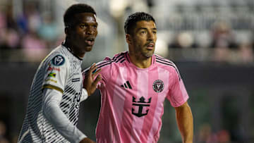 Cavalier FC midfielder Christopher Ainsworth marks Inter Miami striker Luis Suarez during the Herons’ 2-0 Concacaf Champions Cup win Thursday at Chase Stadium.