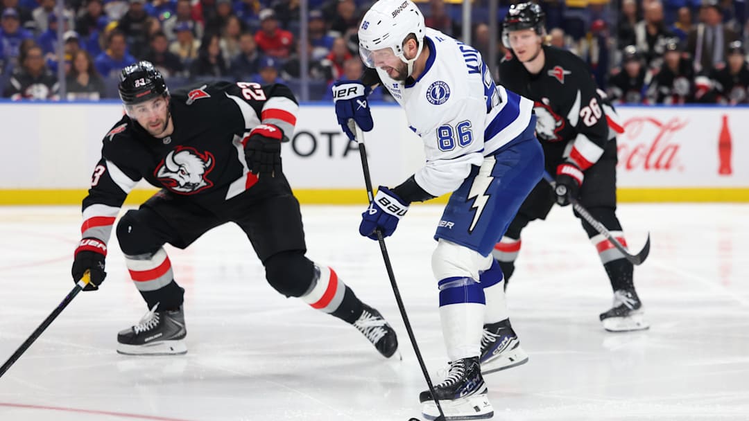 Apr 6, 2026; Buffalo, New York, USA;  Buffalo Sabres defenseman Mattias Samuelsson (23) looks to block a shot by Tampa Bay Lightning right wing Nikita Kucherov (86) during the third period at KeyBank Center. Mandatory Credit: Timothy T. Ludwig-Imagn Images