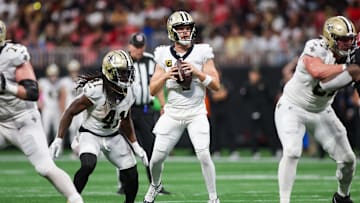 Sep 29, 2024; Atlanta, Georgia, USA; New Orleans Saints quarterback Derek Carr (4) drops back to pass against the Atlanta Falcons in the fourth quarter at Mercedes-Benz Stadium. Mandatory Credit: Brett Davis-Imagn Images