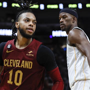 Mar 8, 2023; Miami, Florida, USA; Cleveland Cavaliers guard Darius Garland (10) dribbles the basketball around Miami Heat forward Jimmy Butler (22) during the third quarter at Miami-Dade Arena. Mandatory Credit: Sam Navarro-Imagn Images