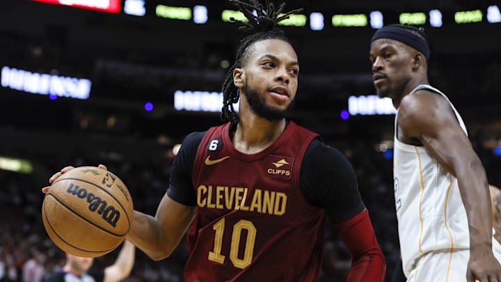 Mar 8, 2023; Miami, Florida, USA; Cleveland Cavaliers guard Darius Garland (10) dribbles the basketball around Miami Heat forward Jimmy Butler (22) during the third quarter at Miami-Dade Arena. Mandatory Credit: Sam Navarro-Imagn Images