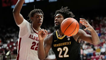 Jan 21, 2025; Tuscaloosa, AL, USA; Alabama forward Aiden Sherrell (22) guards Vanderbilt guard Jaylen Carey (22) as he drives into the lane at Coleman Coliseum.