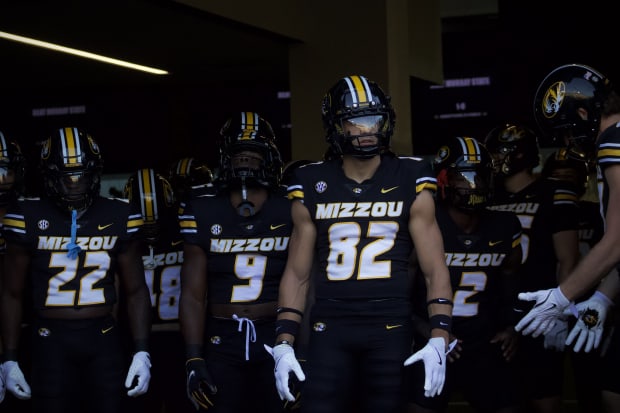 Missouri Tigers junior receiver Logan Muckey (82) leads his team out of the tunnel before their season opener.