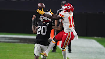 Nov 22, 2020; Paradise, Nevada, USA; Las Vegas Raiders cornerback Damon Arnette (20) breaks up a pass intended for Kansas City Chiefs wide receiver Tyreek Hill (10) during the second half at Allegiant Stadium. Mandatory Credit: Kirby Lee-Imagn Images