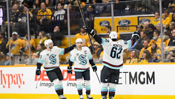 Oct 15, 2024; Nashville, Tennessee, USA; Seattle Kraken right wing Jordan Eberle (7) celebrates his goal with his teammates against the Nashville Predators  during the third period at Bridgestone Arena. Mandatory Credit: Steve Roberts-Imagn Images