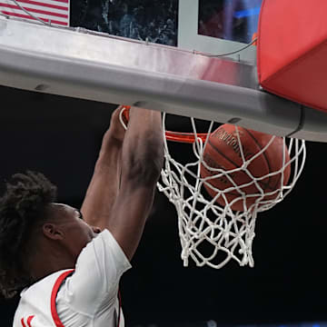 Sun Prairie East's Chris Davis Jr. (4) dunks during the Deer District Prep Showcase game against Stevens Point at Fiserv Forum in Milwaukee, WI. on Saturday, Feb. 8, 2025. 