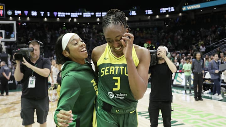 Jul 16, 2025; Seattle, Washington, USA; Seattle Storm guard Lexie Brown (8) and Seattle Storm forward Nneka Ogwumike (3) celebrate after playing the Golden State Valkyries at Climate Pledge Arena. Mandatory Credit: John Froschauer-Imagn Images