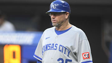 Sep 10, 2025; Cleveland, Ohio, USA; Kansas City Royals major league field coordinator, third base coach Vance Wilson (25) stands on the field in the second inning against the Cleveland Guardians at Progressive Field.