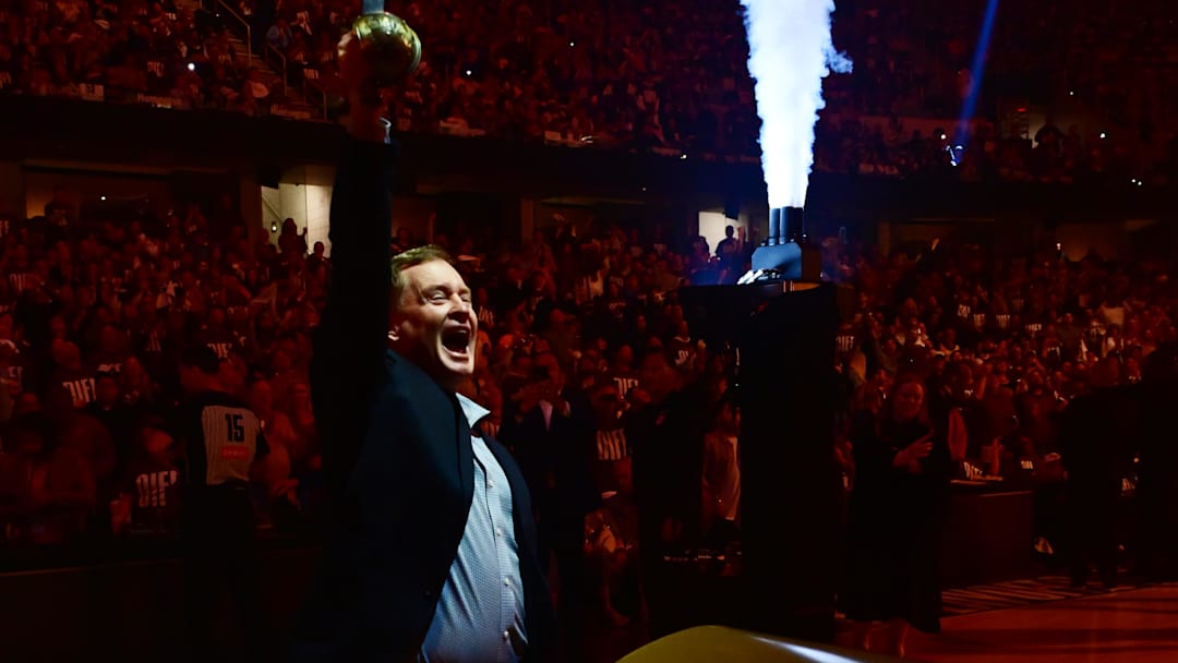 May 4, 2025; Cleveland, Ohio, USA; Former Cleveland Cavaliers player Mark Price pulls a sword out of a Cavs logo before game one of the second round against the Indiana Pacers for the 2025 NBA Playoffs at Rocket Arena. Mandatory Credit: Ken Blaze-Imagn Images