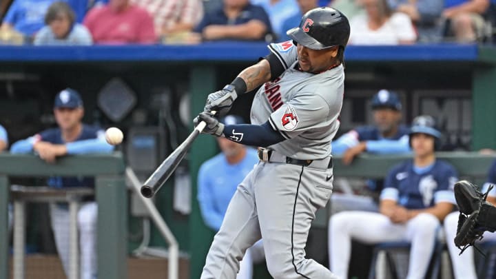 Jun 28, 2024; Kansas City, Missouri, USA;  Cleveland Guardians third baseman Jose Ramirez (11) hits a solo home run in the first inning against the Kansas City Royals at Kauffman Stadium. Mandatory Credit: Peter Aiken-USA TODAY Sports