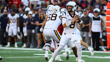 Oct 26, 2024; Tucson, Arizona, USA; West Virginia Mountaineers quarterback Nicco Marchiol (8) looks to throw the ball during the first quarter against the Arizona Wildcats at Arizona Stadium. Mandatory Credit: Aryanna Frank-Imagn Images