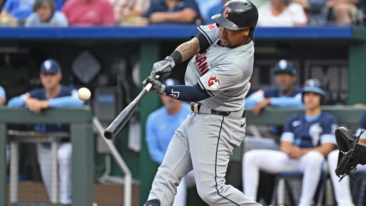 Jun 28, 2024; Kansas City, Missouri, USA;  Cleveland Guardians third baseman Jose Ramirez (11) hits a solo home run in the first inning against the Kansas City Royals at Kauffman Stadium. Mandatory Credit: Peter Aiken-USA TODAY Sports